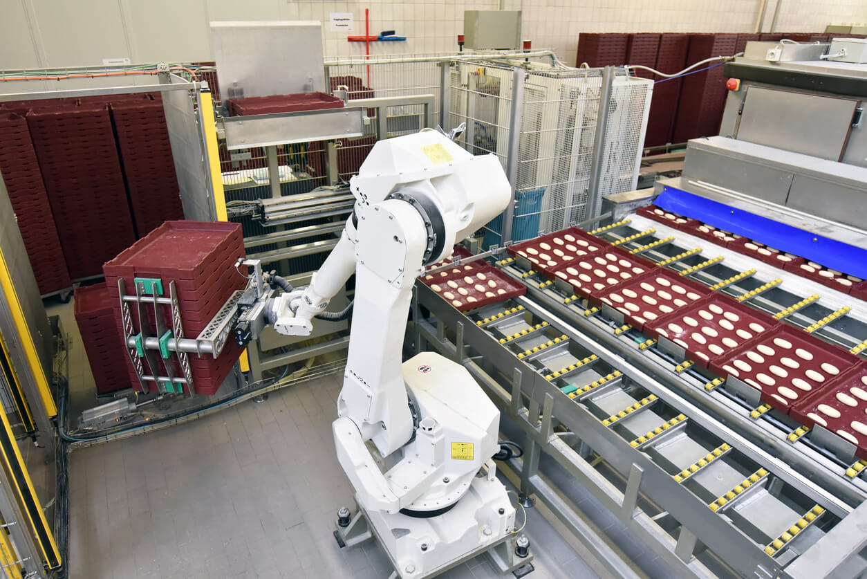 Modern industrial robot in food company - industrial production of bakery products on an assembly line stock photo